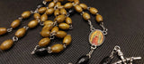 Beautiful natural wooden Guadalupe Rosary with a 4D Papal Crucifix. Kim Williams Rosaries. The Village Artist.