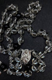 Beautiful Catholic Rosary. Handcrafted black and translucent glass beaded Rosary with a Pope Francis Crucifix and beautiful Sacred Heart of Jesus / Immaculate Heart of Mary Center Piece. By Kim Williams Rosaries. The Village Artist.