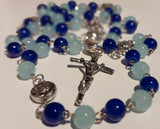 Pope John Paull II Papal crucifix handmade rosary, sapphire and ice blue glass beads, vintage metal roses, Madonna and child center piece, the village artist, one-of-a-kind handmade rosaries, Patenôtrier,  South African artist and jeweler.