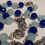 Pope John Paull II Papal crucifix handmade rosary, sapphire and ice blue glass beads, vintage metal roses, Madonna and child center piece, the village artist, one-of-a-kind handmade rosaries, Patenôtrier,  South African artist and jeweler.