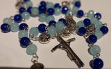 Pope John Paull II Papal crucifix handmade rosary, sapphire and ice blue glass beads, vintage metal roses, Madonna and child center piece, the village artist, one-of-a-kind handmade rosaries, Patenôtrier,  South African artist and jeweler.