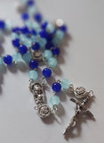 Pope John Paull II Papal crucifix handmade rosary, sapphire and ice blue glass beads, vintage metal roses, Madonna and child center piece, the village artist, one-of-a-kind handmade rosaries, Patenôtrier,  South African artist and jeweler.