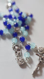Pope John Paull II Papal crucifix handmade rosary, sapphire and ice blue glass beads, vintage metal roses, Madonna and child center piece, the village artist, one-of-a-kind handmade rosaries, Patenôtrier,  South African artist and jeweler.