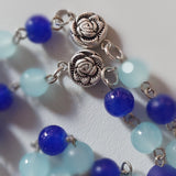 Pope John Paull II Papal crucifix handmade rosary, sapphire and ice blue glass beads, vintage metal roses, Madonna and child center piece, the village artist, one-of-a-kind handmade rosaries, Patenôtrier,  South African artist and jeweler.