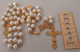 Beautiful one of a kind ivory pearl beads with gold filigree bead caps. Gold disc shaped St benedict beads. Detailed Loretta fleur de Lis gold crucifix. Kim Williams Patenôtrier Rosaries, The Village Artist, Proudly South African, handmade. Catholic Store South African.