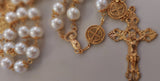 Beautiful one of a kind ivory pearl beads with gold filigree bead caps. Gold disc shaped St benedict beads. Detailed Loretta fleur de Lis gold crucifix. Kim Williams Patenôtrier Rosaries, The Village Artist, Proudly South African, handmade. Catholic Store South African.