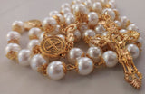 Beautiful one of a kind ivory pearl beads with gold filigree bead caps. Gold disc shaped St benedict beads. Detailed Loretta fleur de Lis gold crucifix. Kim Williams Patenôtrier Rosaries, The Village Artist, Proudly South African, handmade. Catholic Store South African.