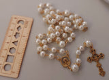 Beautiful one of a kind ivory pearl beads with gold Our Lady of Sorrows Mater Dolorosa  center piece and detailed Loretta fleur de Lis gold crucifix. Kim Williams Patenôtrier Rosaries, The Village Artist, Proudly South African, handmade. Catholic Store South African.