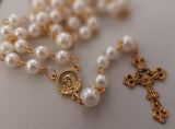 Beautiful one of a kind ivory pearl beads with gold Our Lady of Sorrows Mater Dolorosa  center piece and detailed Loretta fleur de Lis gold crucifix. Kim Williams Patenôtrier Rosaries, The Village Artist, Proudly South African, handmade. Catholic Store South African.