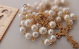 Beautiful one of a kind ivory pearl beads with gold Our Lady of Sorrows Mater Dolorosa  center piece and detailed Loretta fleur de Lis gold crucifix. Kim Williams Patenôtrier Rosaries, The Village Artist, Proudly South African, handmade. Catholic Store South African.