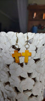 Yello seashell cross faith earrings