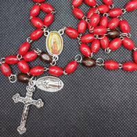 Beautiful red wooden Guadalupe center piece, Medjugorje ornate Crucifix and vintage silver Our Lady of Guadalupe medallion. Kim Williams Rosaries, the Village Artist.