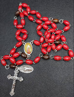 Beautiful red wooden Guadalupe center piece, Medjugorje ornate Crucifix and vintage silver Our Lady of Guadalupe medallion. Kim Williams Rosaries, the Village Artist.